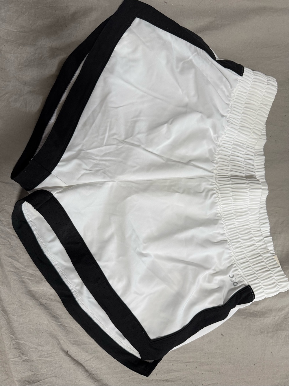 DSG White High-Rise Stride Shorts with Black Logo Accent